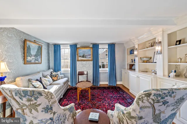 a view of living room kitchen with stainless steel appliances granite countertop furniture and a fireplace