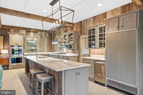 a bedroom with a bed and glass window