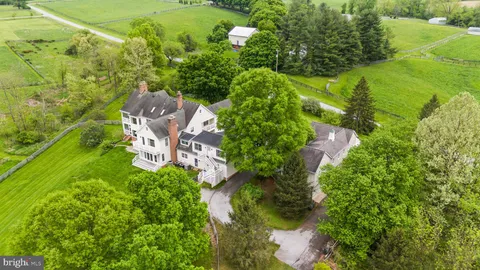 a view of a house with swimming pool