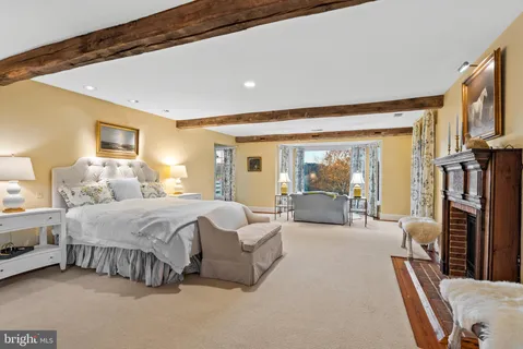 a bedroom with a bed and a table in it