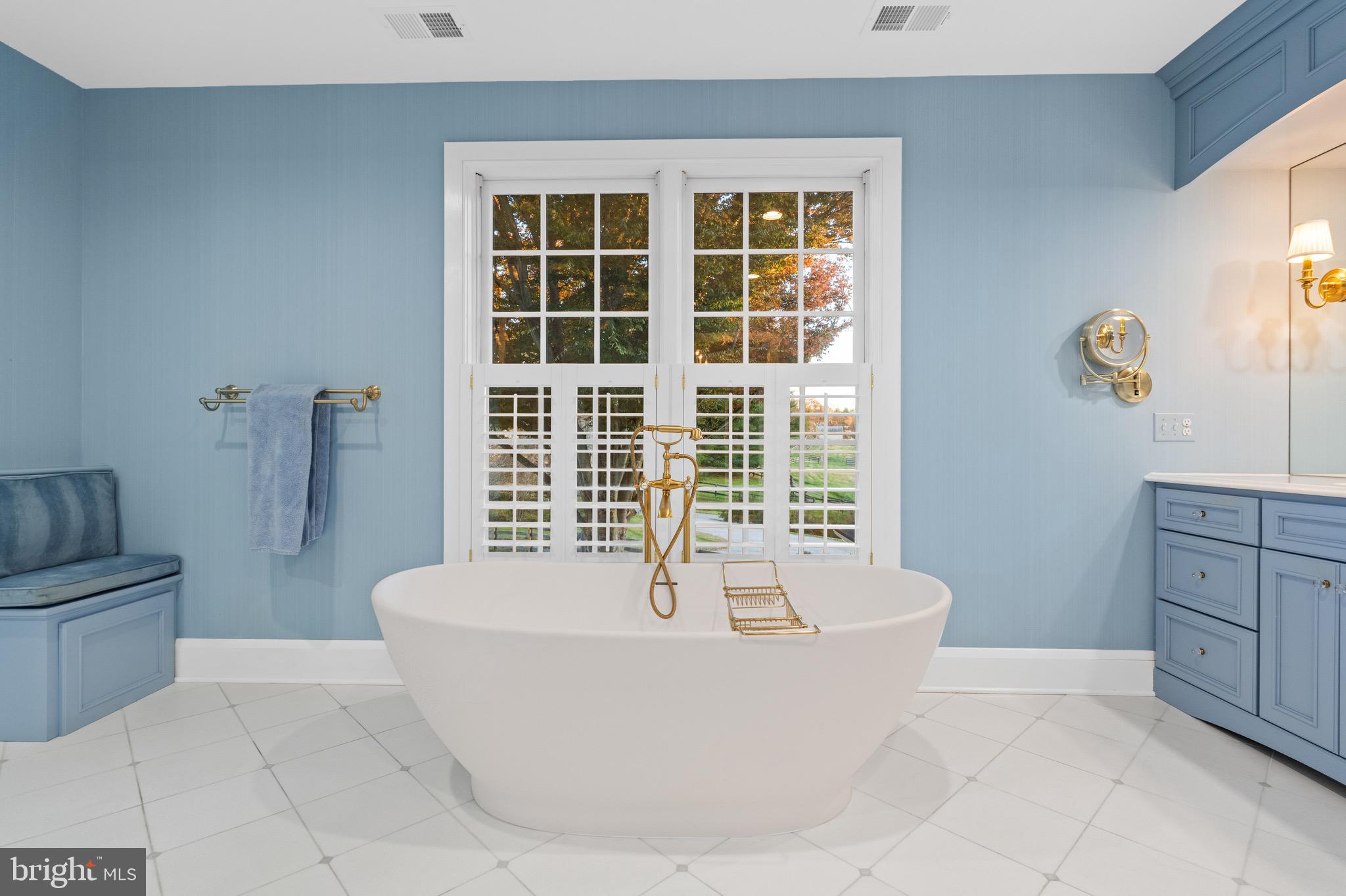 2310 Gadd Road Cockeysville, MD 21030 - Photo 52 of 83 a white bath tub sitting in a bathroom next to a window