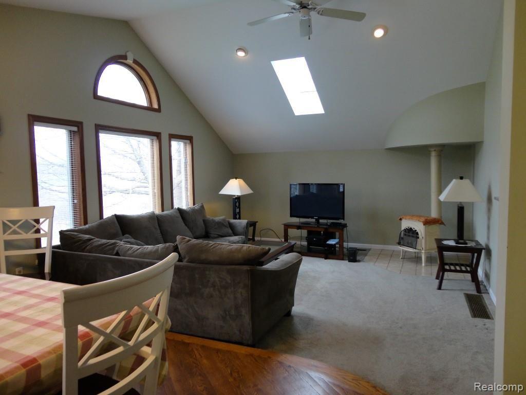 Beautiful Living Room with Cathedral Ceiling and Wood Stove