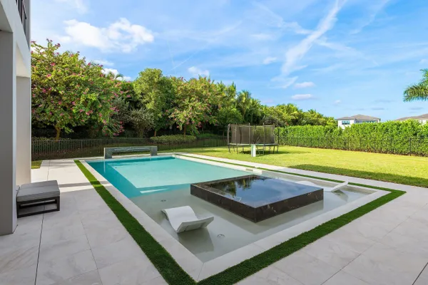 a view of swimming pool with chairs