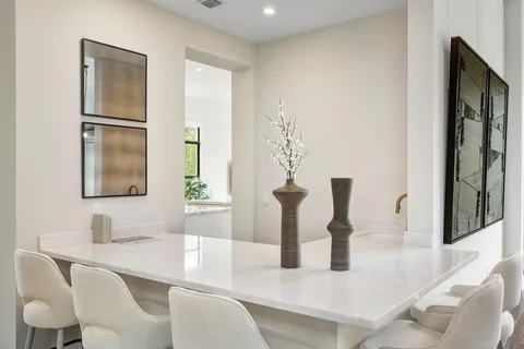 a dining room with furniture and a table