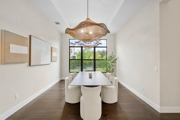 a dining room with furniture and window
