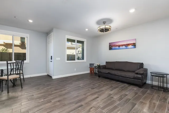 a view of kitchen with furniture and refrigerator