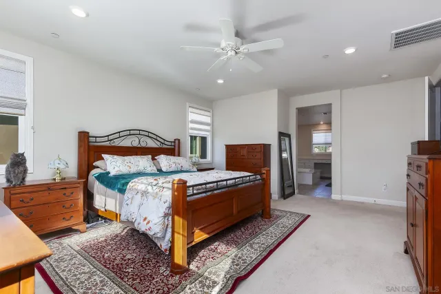 a view of room with window and ceiling fan
