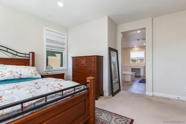 an empty room with closet and windows