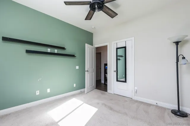 a view of a house with swimming pool and sitting area