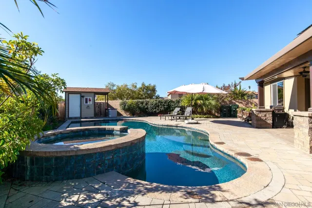 a large kitchen with a table and chairs