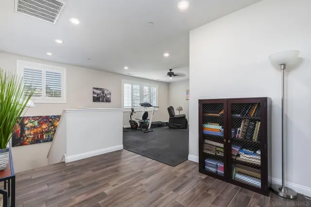 a view of a kitchen with a stove and sitting area