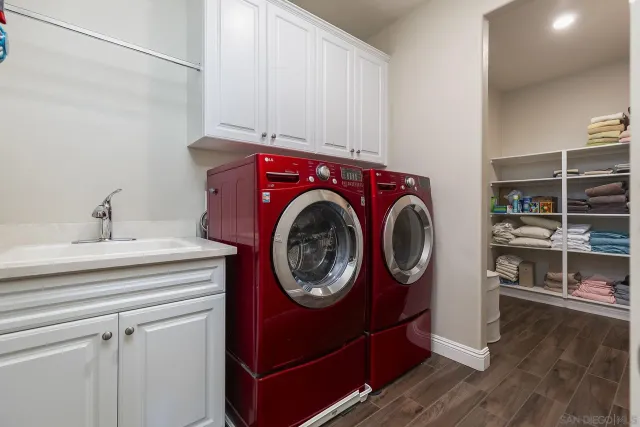 a green field with some trees in the background