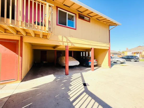 a view of a patio with a table and chairs