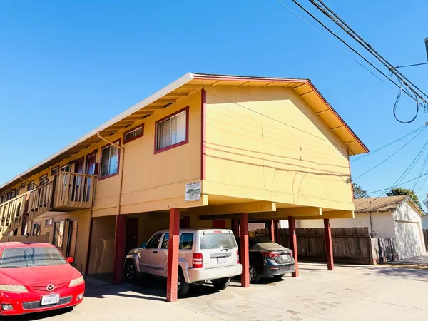 a front view of a house with parking