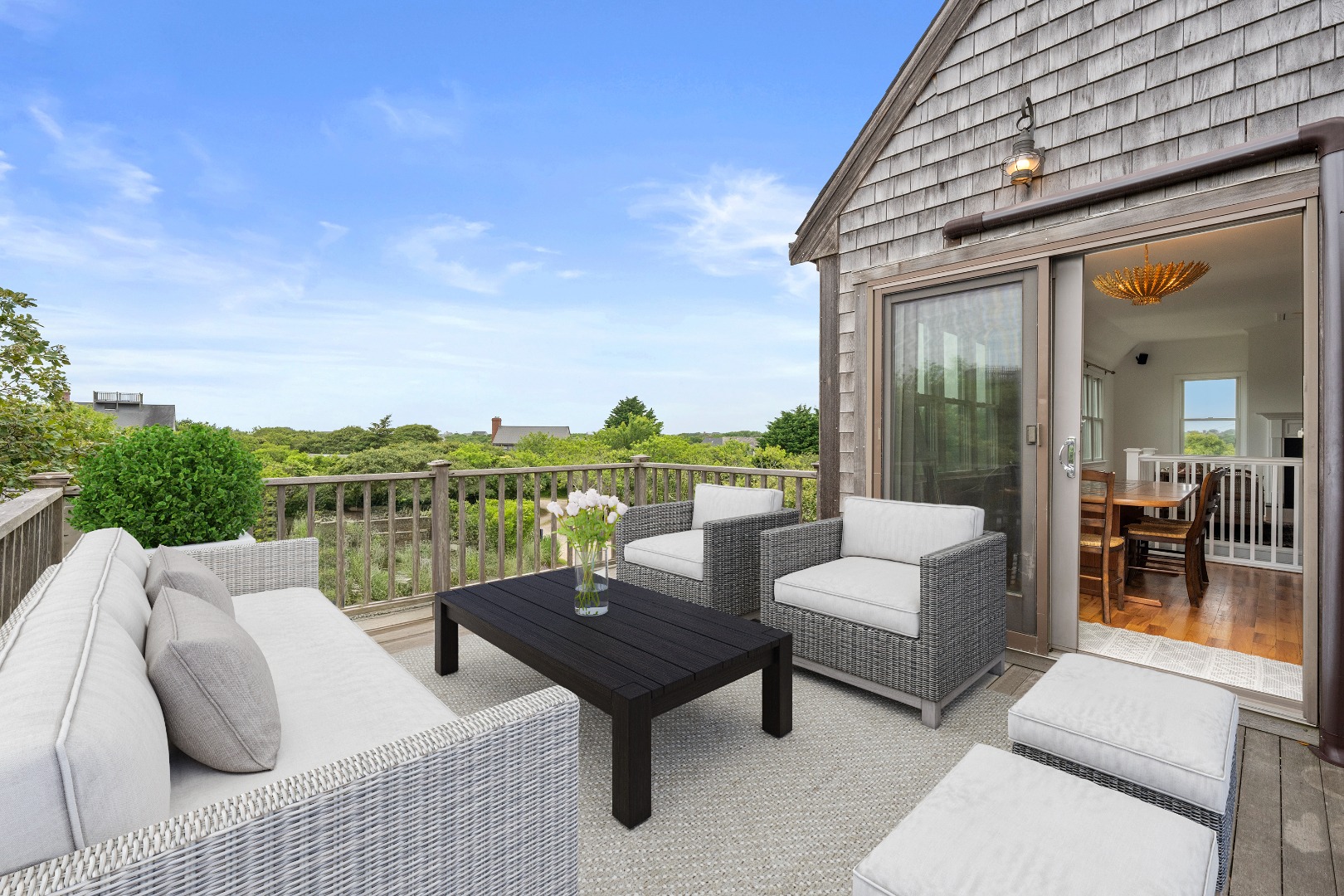 4 Berkley Street Nantucket, MA 02554 - Photo 1 of 47 a view of a roof deck with couches and potted plants