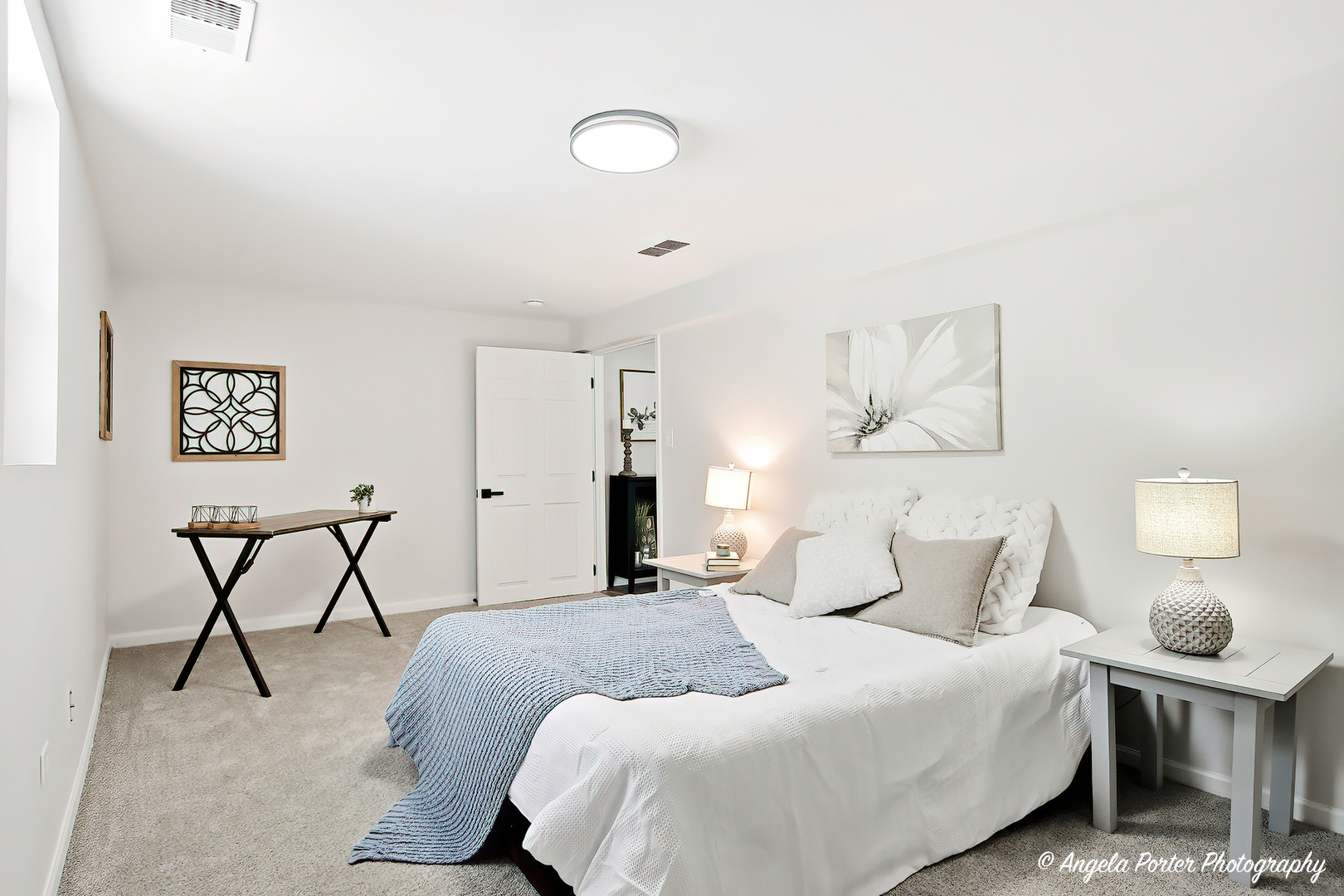 27283 West Nippersink Road Ingleside, IL 60041 - Photo 16 of 23 a bedroom with a bed and a chandelier