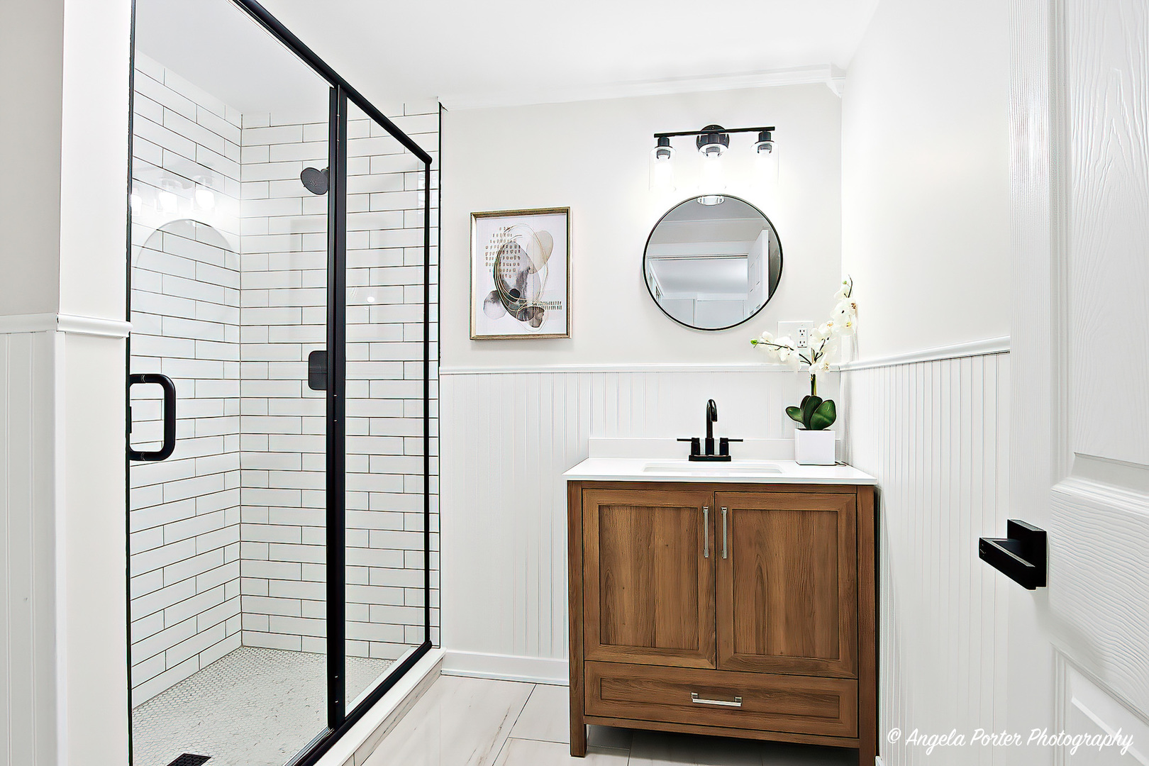 27283 West Nippersink Road Ingleside, IL 60041 - Photo 19 of 23 a bathroom with a sink a mirror and shower