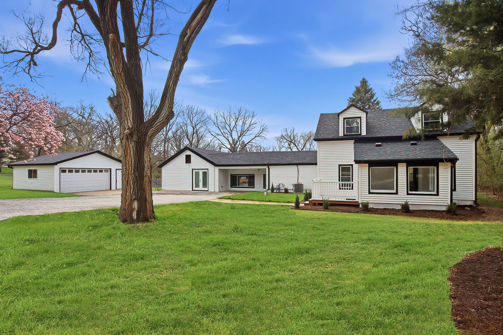 27283 West Nippersink Road Ingleside, IL 60041 - Photo 2 of 23 a front view of a house with a garden