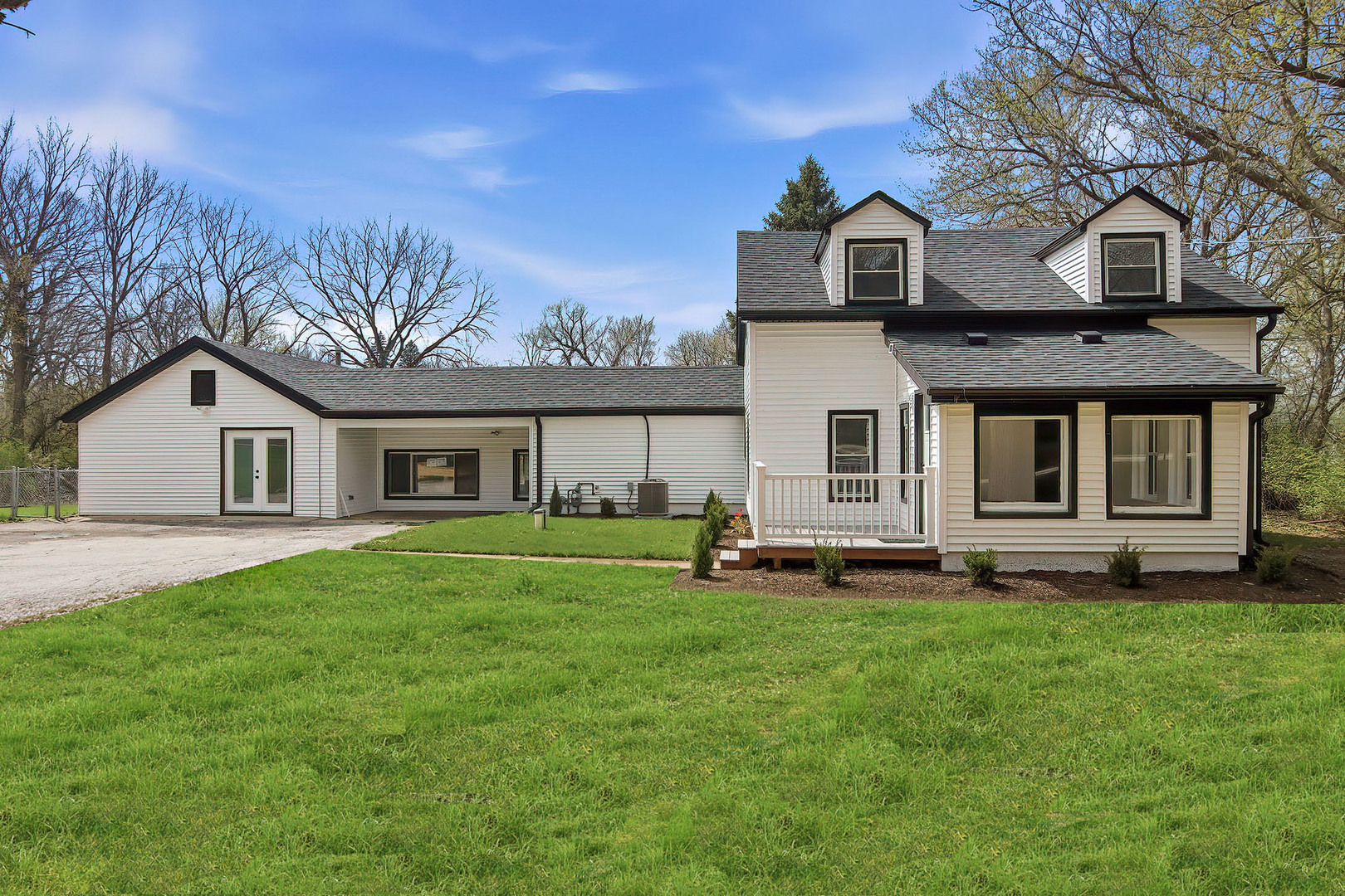 27283 West Nippersink Road Ingleside, IL 60041 - Photo 3 of 23 a front view of a house with a garden