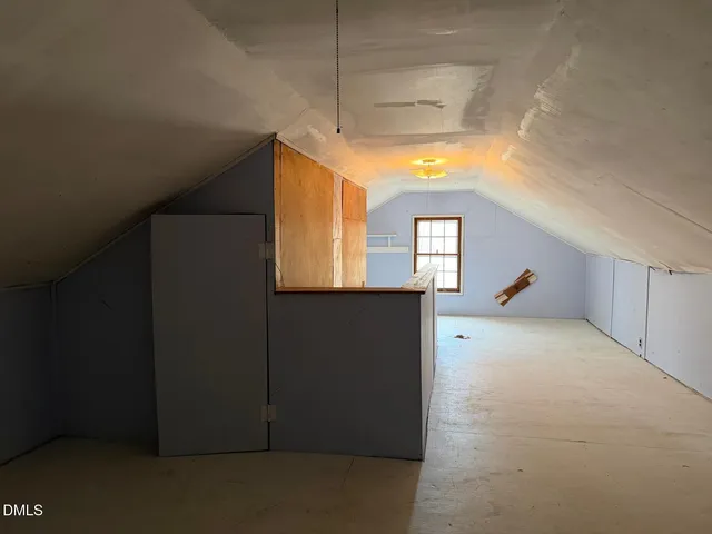 a view of a hallway with a window