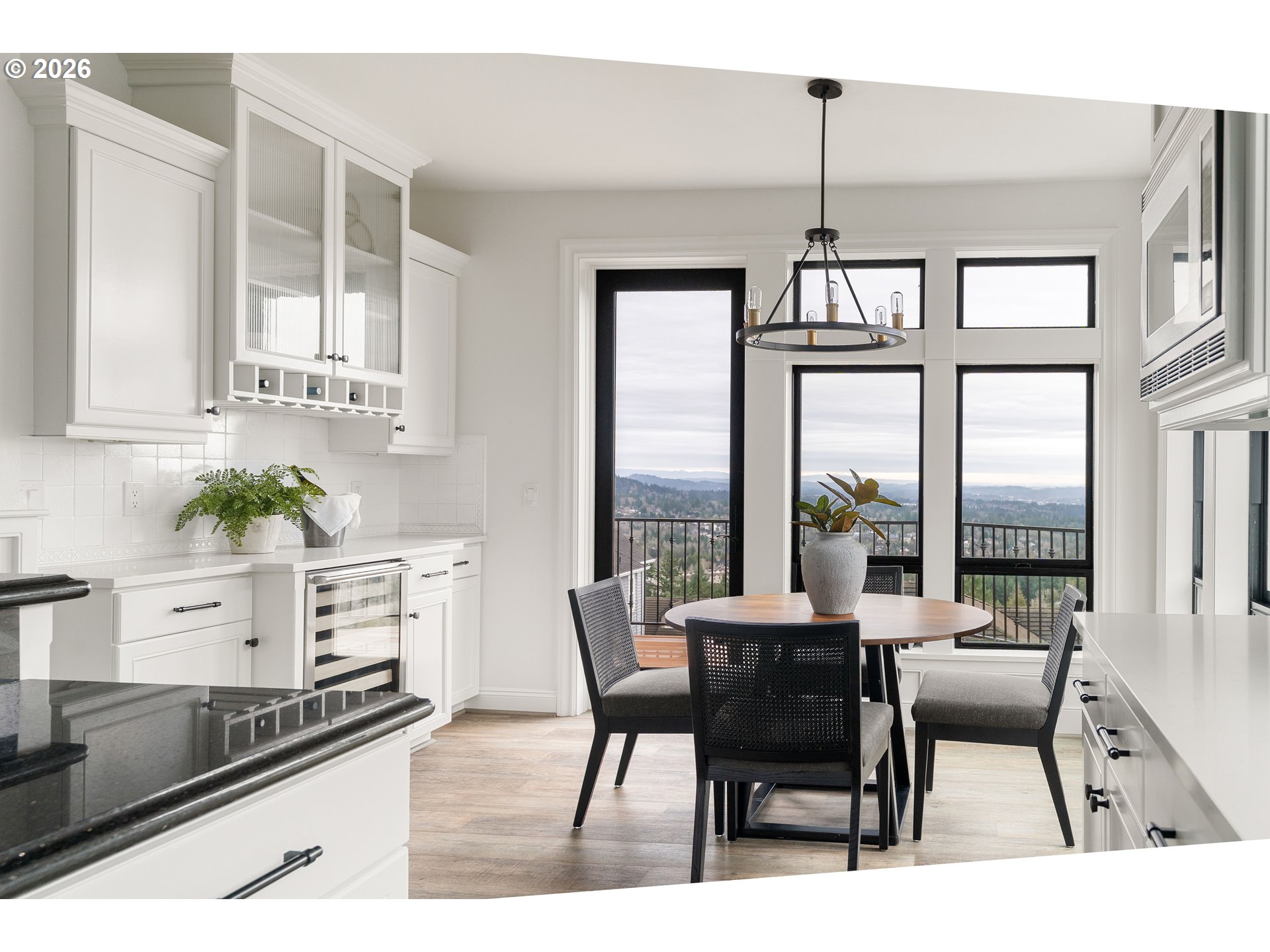 10230 Northwest Gloaming Lane Portland, OR 97229 - Photo 13 of 48 a dining room with furniture a chandelier and wooden floor