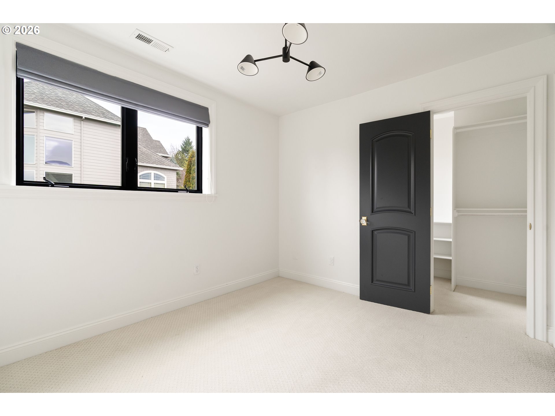 10230 Northwest Gloaming Lane Portland, OR 97229 - Photo 26 of 48 a view of an empty room with a window