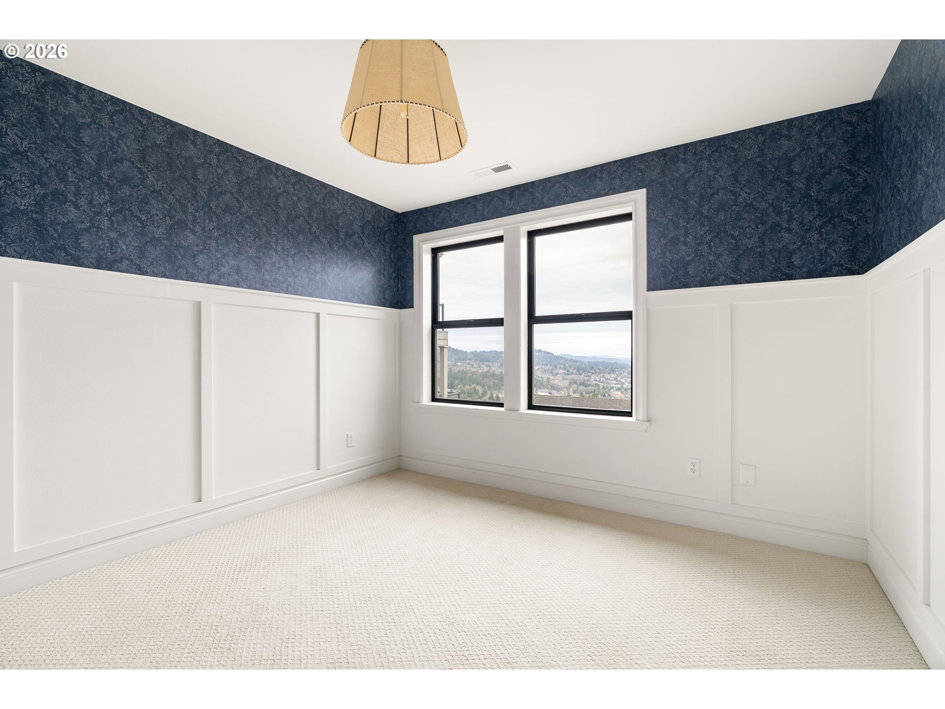 10230 Northwest Gloaming Lane Portland, OR 97229 - Photo 27 of 48 a view of an empty room with windows