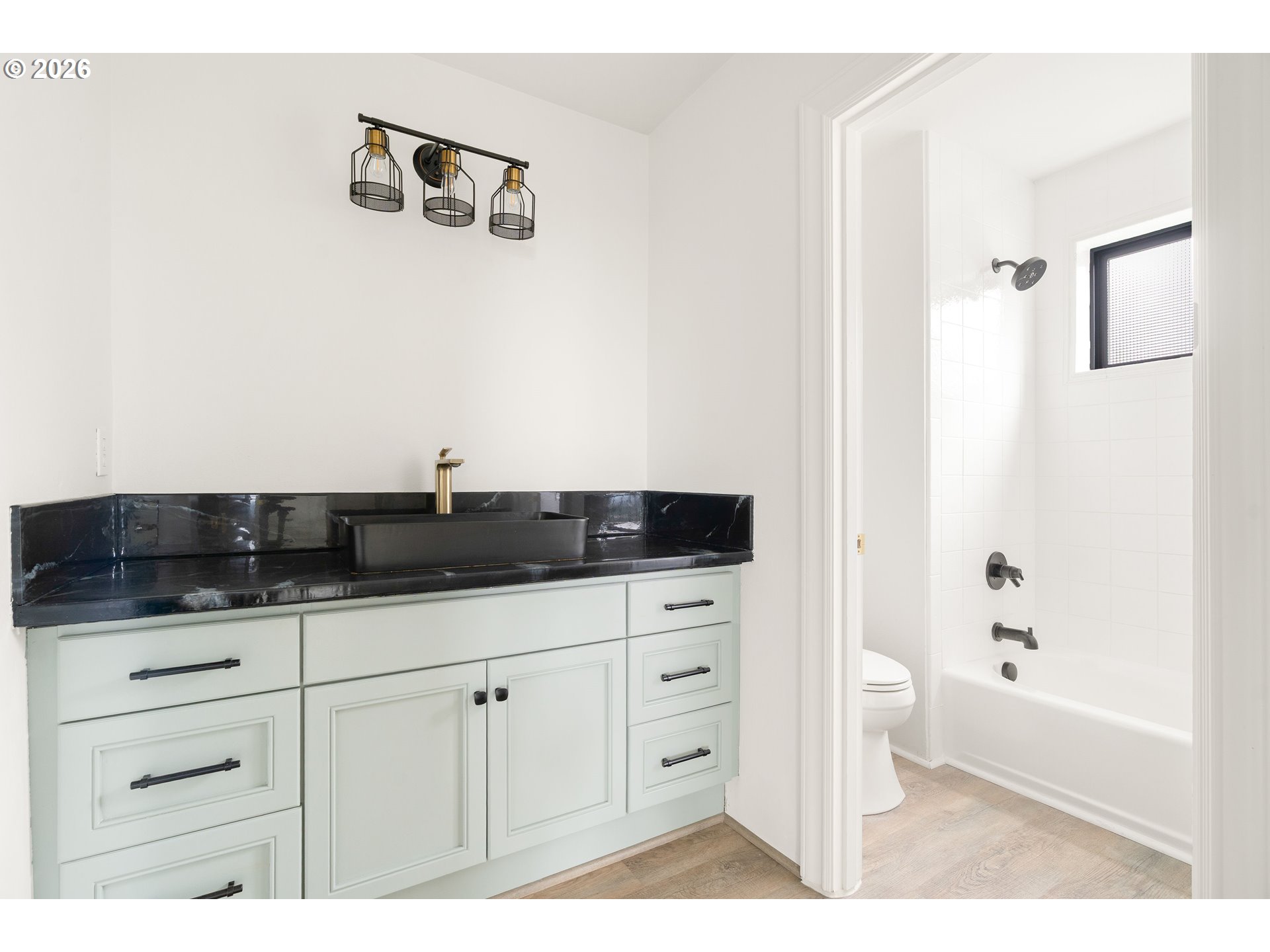10230 Northwest Gloaming Lane Portland, OR 97229 - Photo 28 of 48 a bathroom with a sink a toilet and vanity