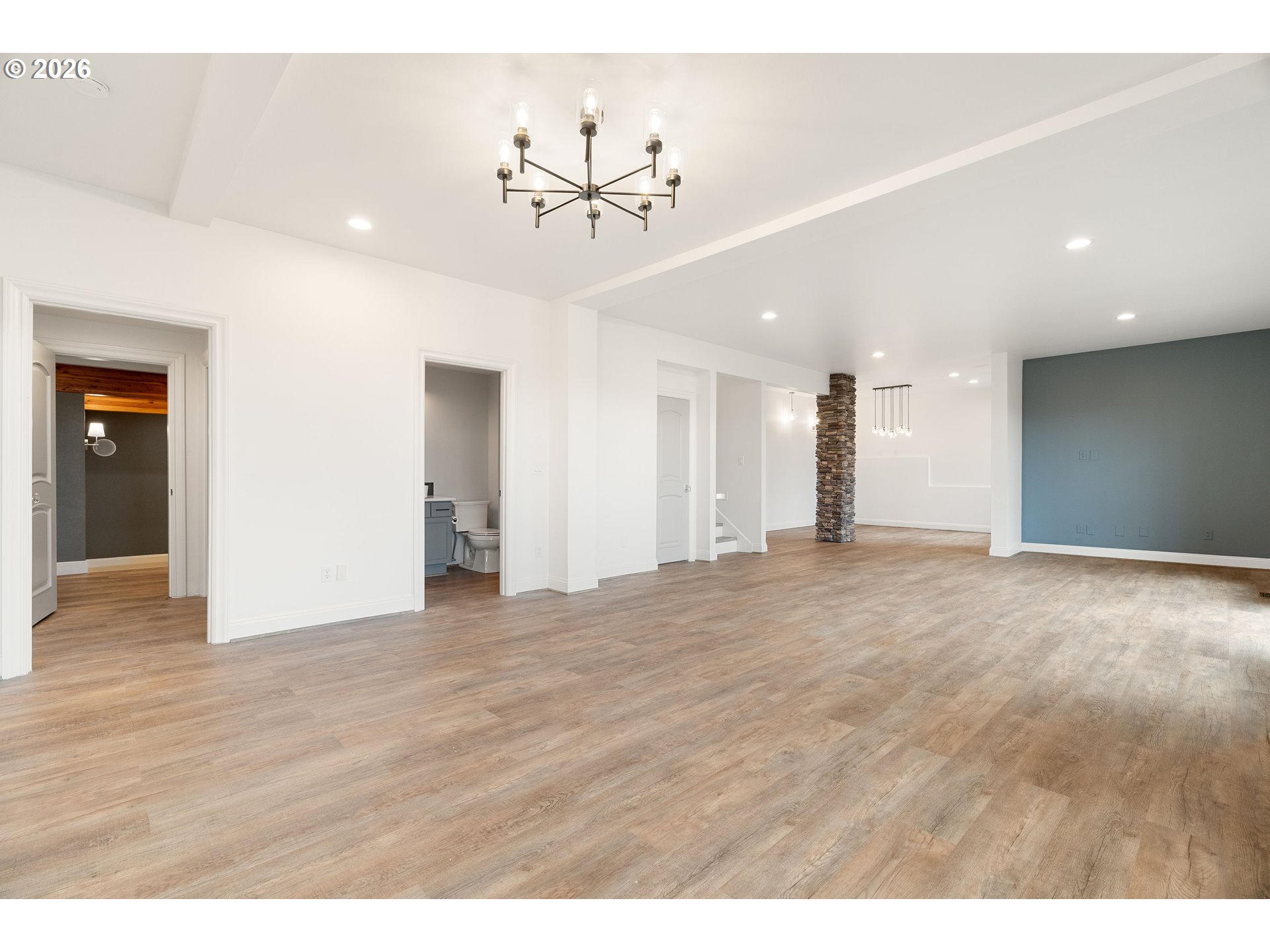 10230 Northwest Gloaming Lane Portland, OR 97229 - Photo 33 of 48 a view of an empty room with wooden floor