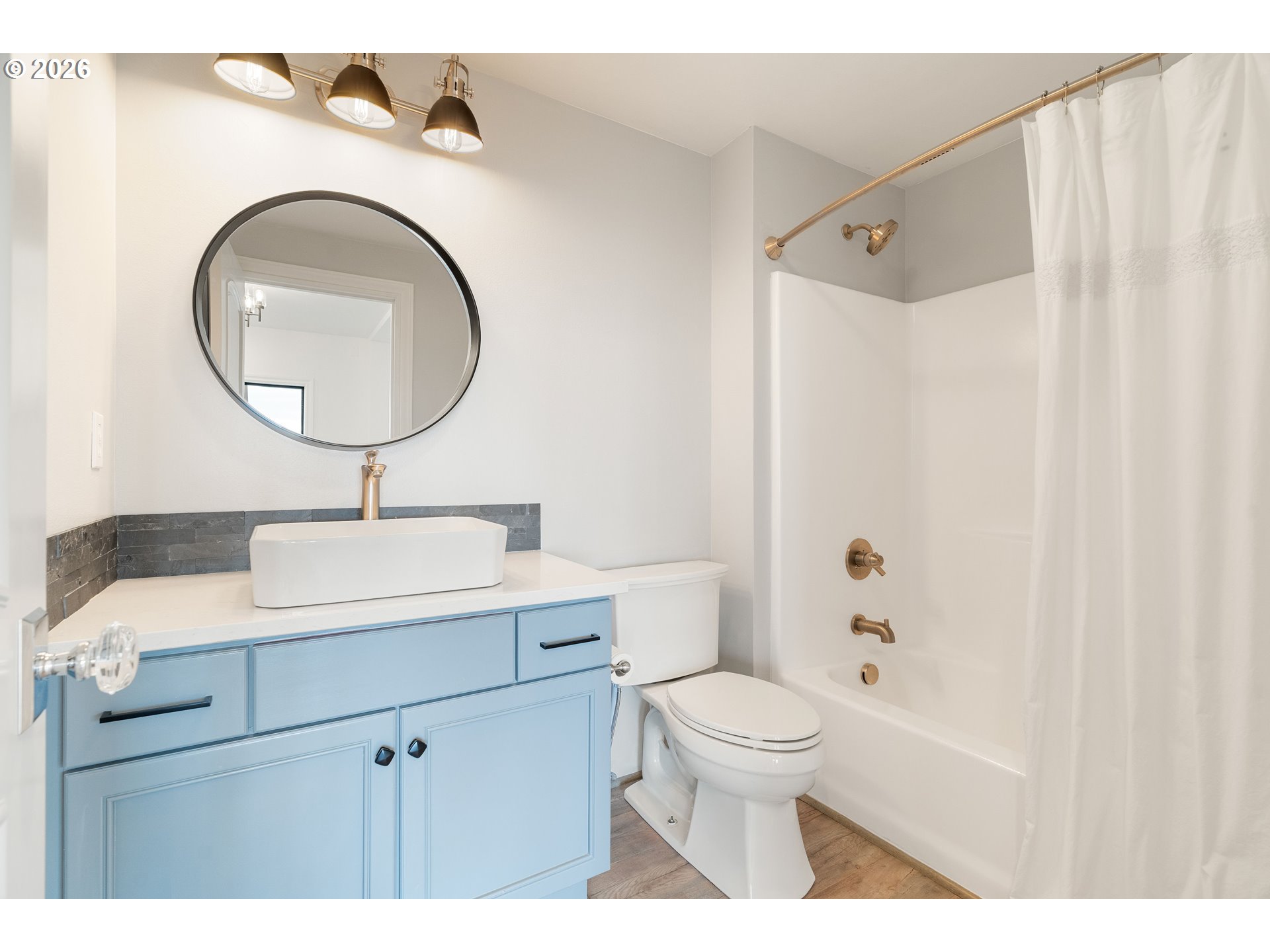 10230 Northwest Gloaming Lane Portland, OR 97229 - Photo 34 of 48 a bathroom with a sink a mirror a toilet and a mirror