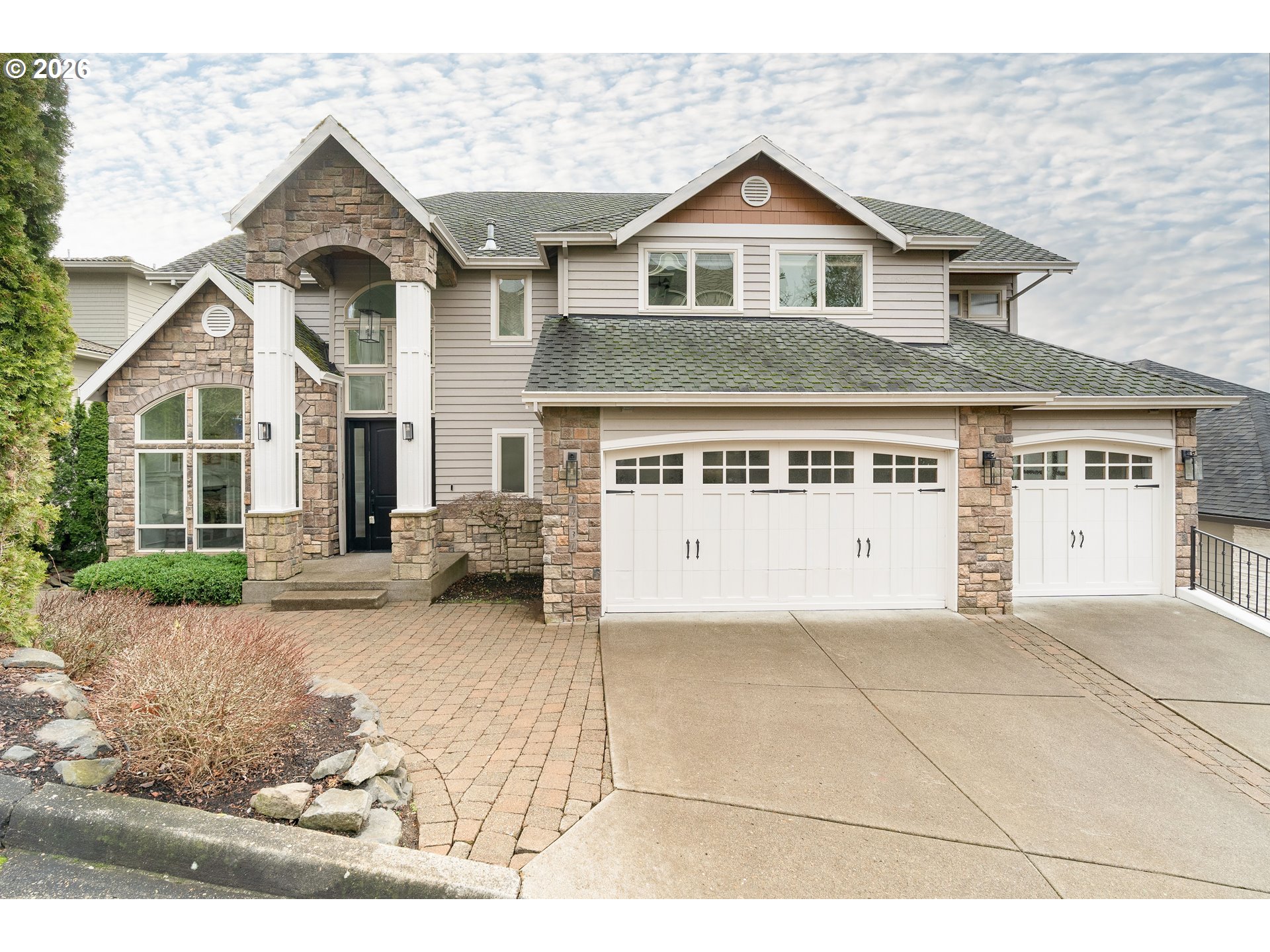 10230 Northwest Gloaming Lane Portland, OR 97229 - Photo 45 of 48 a front view of a house with a yard and garage