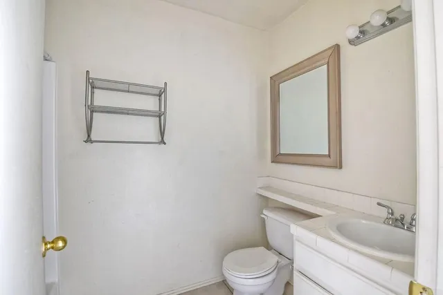 a bathroom with a toilet and a sink