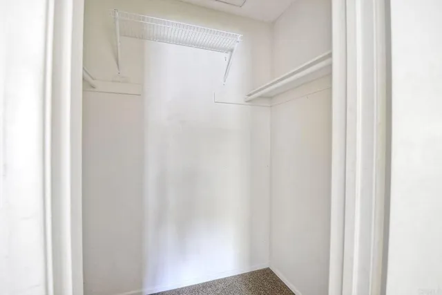 a view of a balcony with wooden fence