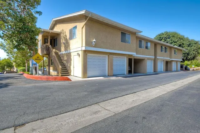 a view of a house with a street