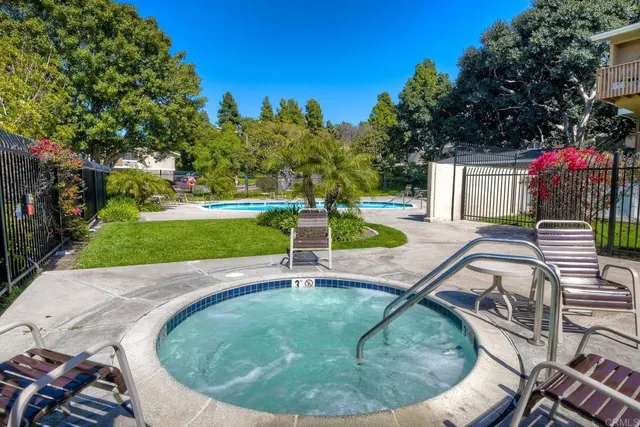 an outdoor space with pool and furniture