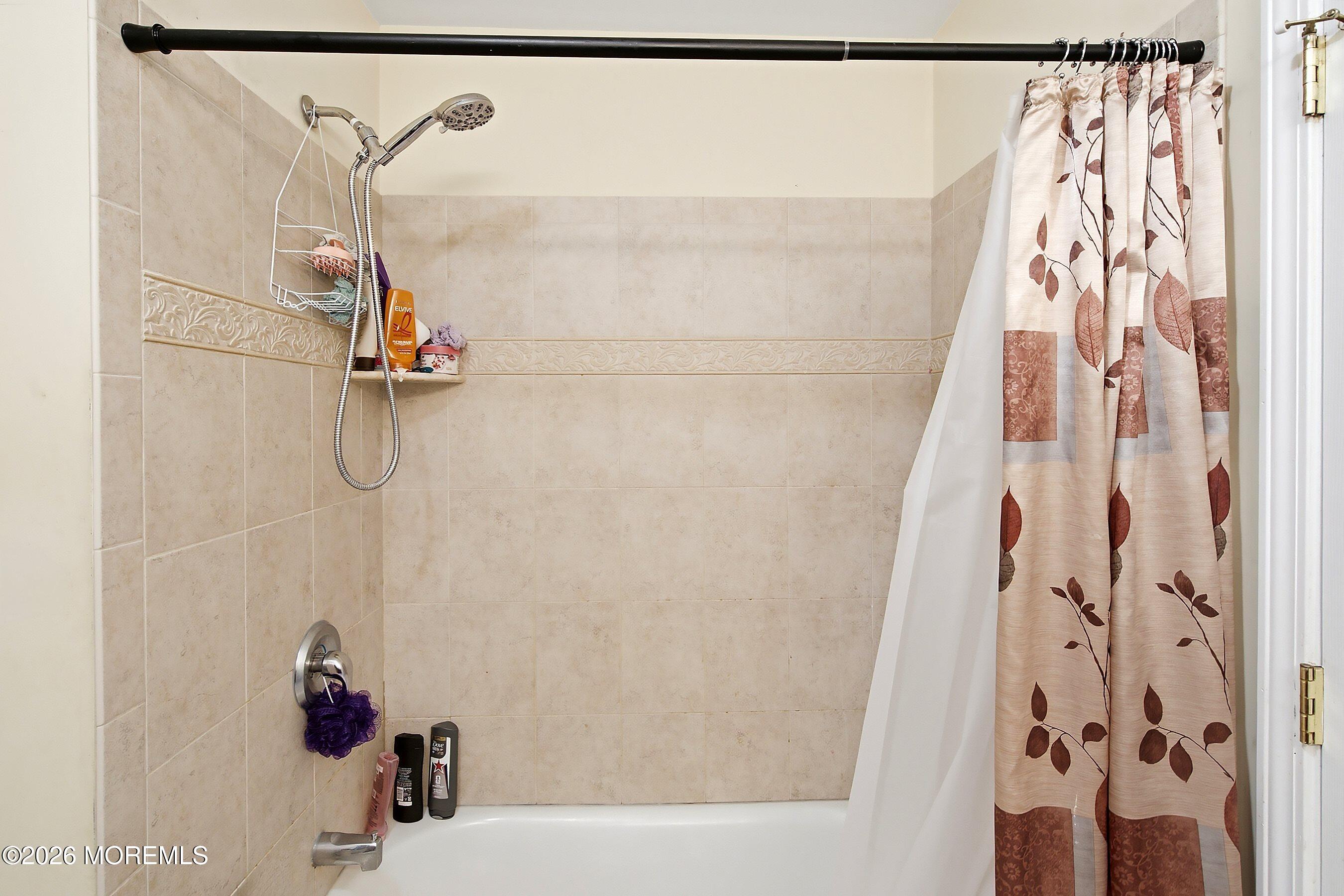 935 Bethel Church Road Jackson, NJ 08527 - Photo 22 of 32 a bathroom with a shower and a sink