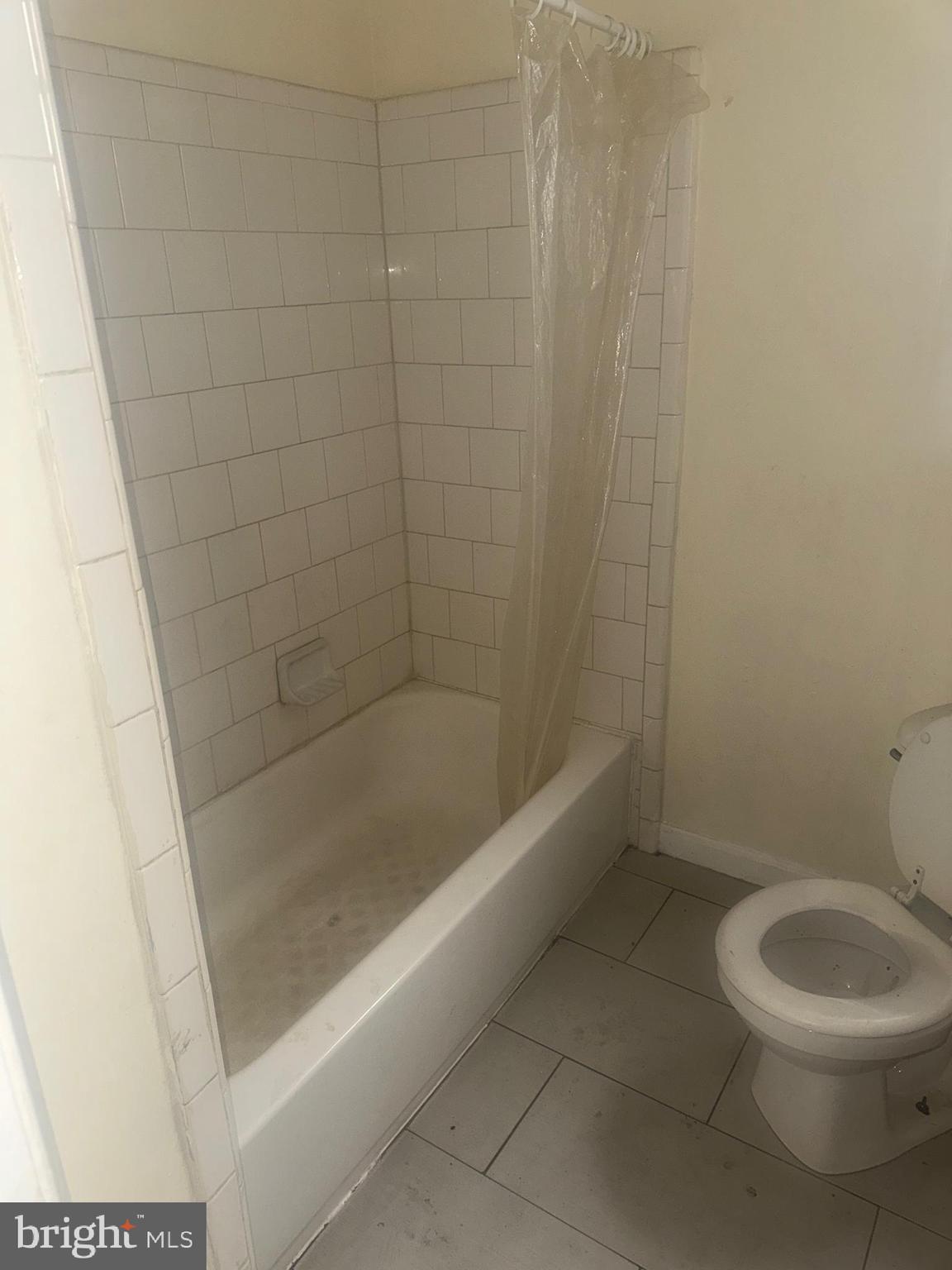 1022 North Gilmor Street Baltimore, MD 21217 - Photo 11 of 16 a bath room with a toilet and a shower