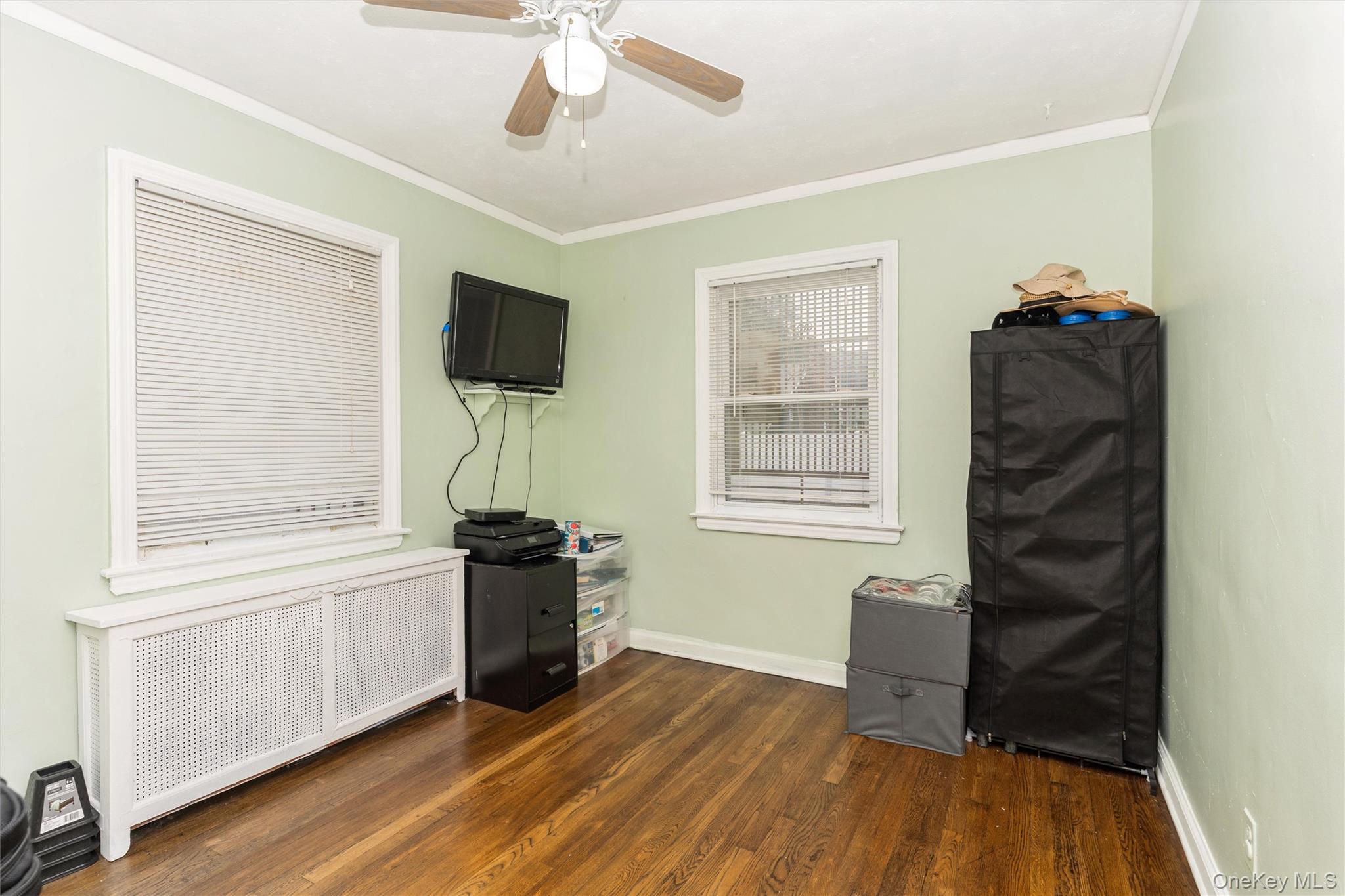 6 Jasper Street Valley Stream, NY 11580 - Photo 9 of 19 a living room with furniture and a flat screen tv