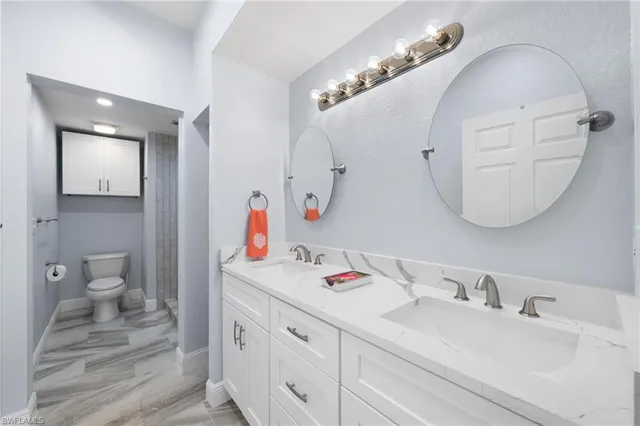 a bathroom with a sink vanity and a mirror