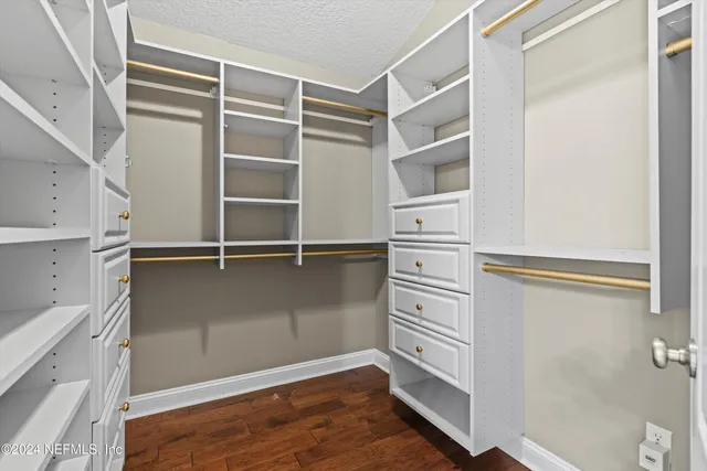 a view of an empty walk in closet