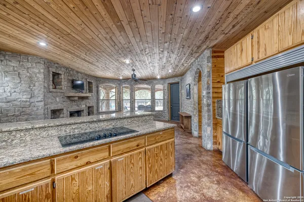 a kitchen with granite countertop a sink and a window