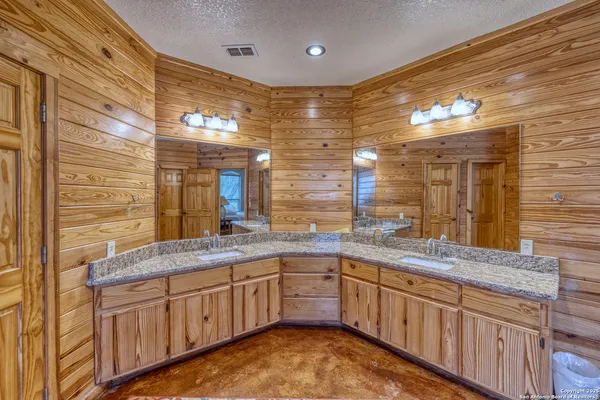 a bed room with a bed and wooden floor