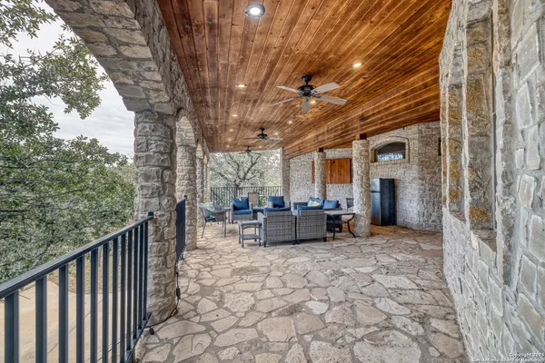 a view of a chairs and table in a patio
