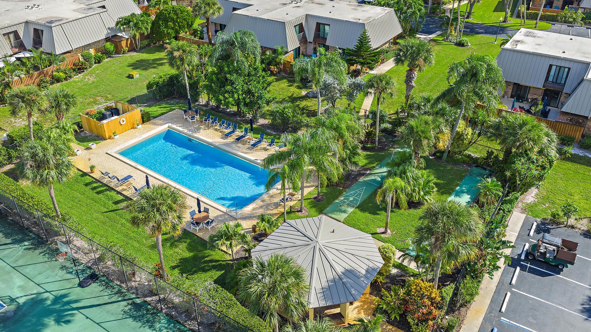 1420 Ocean Way, Unit 30C Jupiter, FL 33477 - Photo 22 of 25 an aerial view of a house with a yard and garden