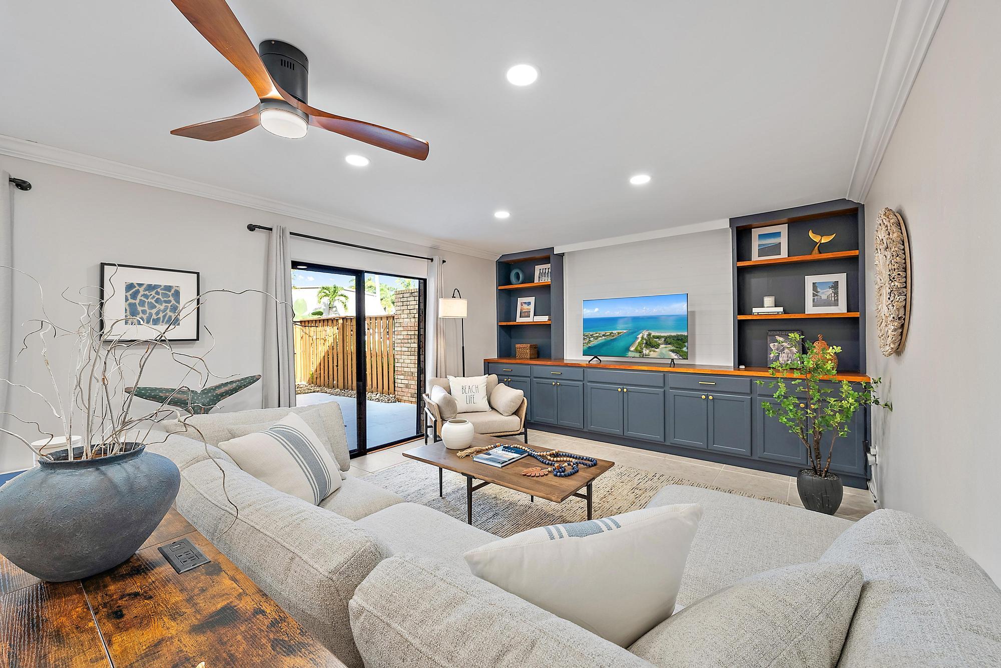 1420 Ocean Way, Unit 30C Jupiter, FL 33477 - Photo 10 of 25 a living room with furniture and a wooden floor
