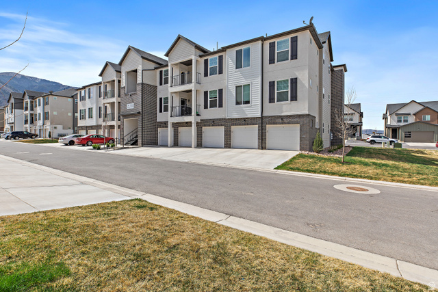 4735 Alder Drive, Unit F101 Mapleton, UT 84664 - Photo 23 of 30 View of asphalt road with curbs and a mountain view