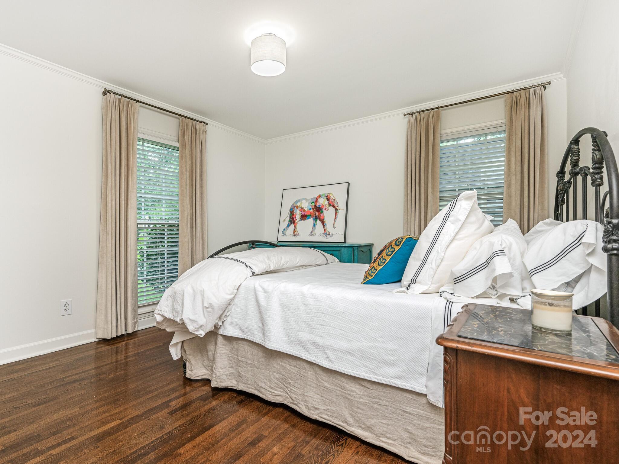 3912 Lovett Circle Charlotte, NC 28210 - Photo 18 of 25 a bedroom with a bed and wooden floor