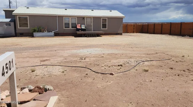 a view of a backyard of a house