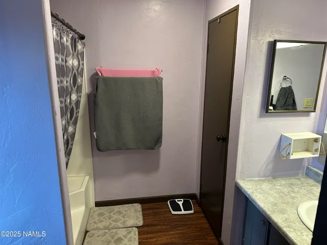 a bathroom with a sink and mirror