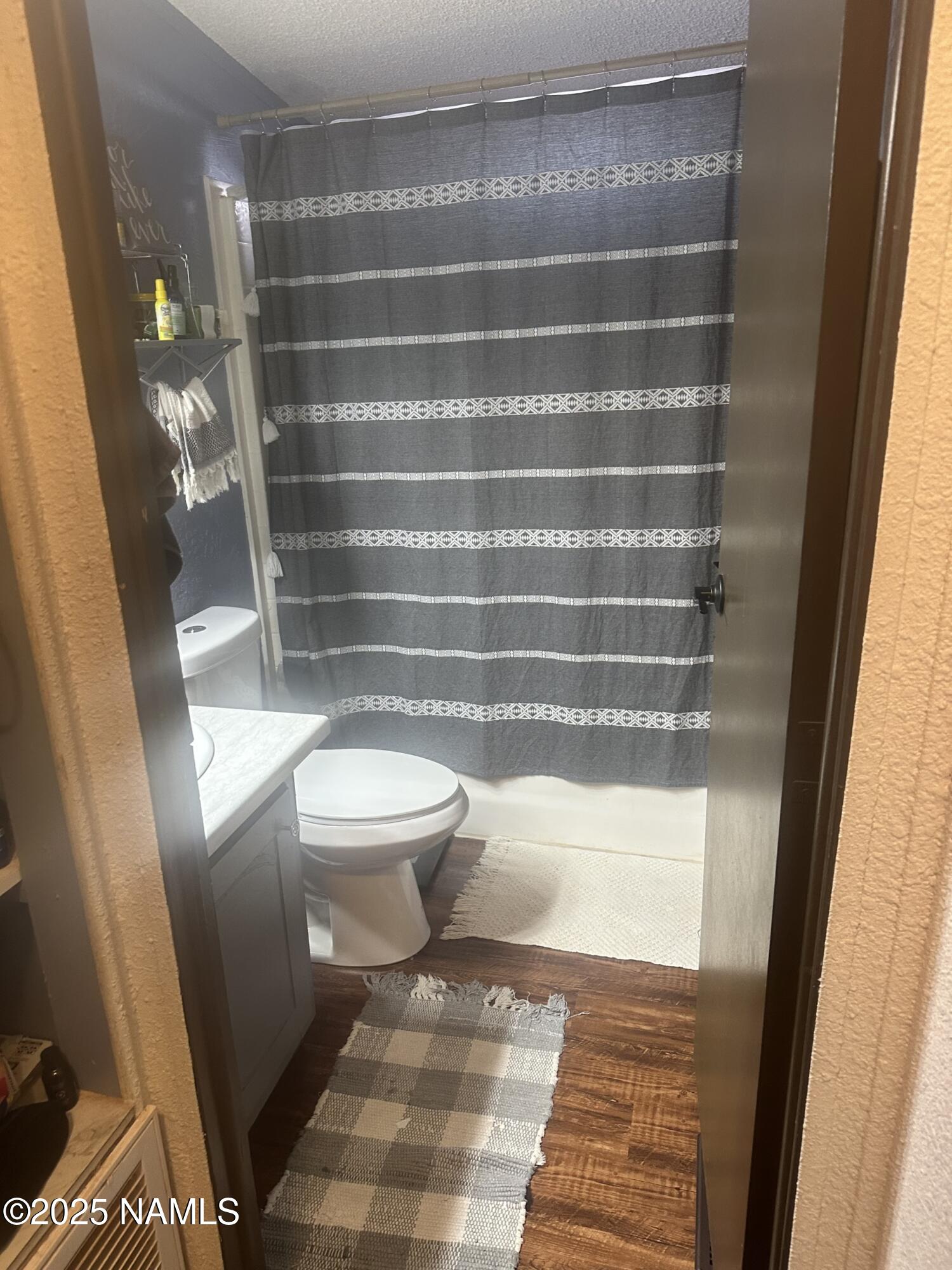 4501 Well Field Road Winslow, AZ 86047 - Photo 6 of 13 a bathroom with a toilet and a shower